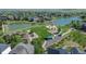 Aerial shot of a green space with a walking trail, playground, pond, picnic shelter, and manicured landscaping at 7506 Chipmunk Pl, Littleton, CO 80125