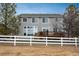 Rear exterior with a deck overlooking the spacious backyard at 7506 Chipmunk Pl, Littleton, CO 80125