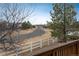 Back deck view of well-maintained lawn and neighboring homes at 7506 Chipmunk Pl, Littleton, CO 80125