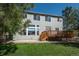 Exterior view of home highlighting the deck and back yard at 7506 Chipmunk Pl, Littleton, CO 80125