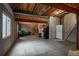 Unfinished basement area with exposed ceiling, concrete floors, and potential for customization at 7506 Chipmunk Pl, Littleton, CO 80125