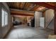 Unfinished basement with exposed ceiling and concrete walls; ready for customization at 7506 Chipmunk Pl, Littleton, CO 80125