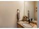 Stylish half bathroom featuring granite countertop and modern fixtures, offering convenience at 7506 Chipmunk Pl, Littleton, CO 80125