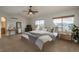 Bright primary bedroom boasts vaulted ceilings and lots of natural light at 7506 Chipmunk Pl, Littleton, CO 80125
