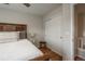 Bedroom with hardwood flooring and closet storage at 7506 Chipmunk Pl, Littleton, CO 80125