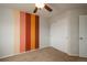 Bedroom with carpet and accent wall in the background at 7506 Chipmunk Pl, Littleton, CO 80125