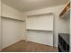 Walk-in closet features a carpet floor, multiple levels of shelving, and closet rod at 7506 Chipmunk Pl, Littleton, CO 80125