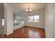 Inviting dining area with hardwood floors and a classic chandelier, perfect for gatherings at 7506 Chipmunk Pl, Littleton, CO 80125