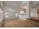 Bright living room featuring large windows and plush carpeting, ready for relaxation at 7506 Chipmunk Pl, Littleton, CO 80125