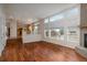 Bright and airy living room with beautiful hardwood floors and large windows, ideal for entertaining at 7506 Chipmunk Pl, Littleton, CO 80125