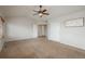 Bright main bedroom with plush carpet, featuring a ceiling fan, and light walls at 7506 Chipmunk Pl, Littleton, CO 80125