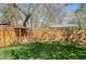 Spacious backyard featuring a wooden fence, fort, and a well-maintained grassy lawn at 6925 W 27Th Ave, Wheat Ridge, CO 80033