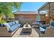 Relaxing backyard patio featuring comfortable outdoor seating around a fire pit and a soothing hot tub at 6925 W 27Th Ave, Wheat Ridge, CO 80033