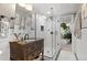 Elegant bathroom with a glass shower, updated vanity, and stylish decor at 6925 W 27Th Ave, Wheat Ridge, CO 80033