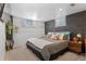 Relaxing bedroom with decorative pillows, wood accent wall, and stylish accents at 6925 W 27Th Ave, Wheat Ridge, CO 80033