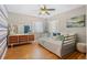 Bright bedroom with hardwood floors, neutral tones, and ample natural light from the windows at 6925 W 27Th Ave, Wheat Ridge, CO 80033