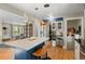 Spacious kitchen featuring a large island with seating and stainless steel appliances at 6925 W 27Th Ave, Wheat Ridge, CO 80033