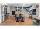 Stylish kitchen featuring a large island, modern stainless steel appliances, and white cabinetry at 6925 W 27Th Ave, Wheat Ridge, CO 80033