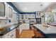Beautiful kitchen with white cabinets, stainless steel appliances, subway tile backsplash, and an island at 6925 W 27Th Ave, Wheat Ridge, CO 80033