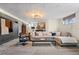 Spacious living room with a comfortable sectional sofa and modern decor at 6925 W 27Th Ave, Wheat Ridge, CO 80033