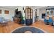 Cozy living room showcasing hardwood floors, stylish furnishings, and an open layout that connects to the kitchen at 6925 W 27Th Ave, Wheat Ridge, CO 80033