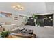 Bright living room with a large window, comfortable seating, and contemporary design at 6925 W 27Th Ave, Wheat Ridge, CO 80033