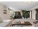 Cozy living room featuring neutral tones, modern lighting, and stylish decor at 6925 W 27Th Ave, Wheat Ridge, CO 80033
