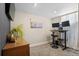Modern home office with a standing desk, neutral colors, and minimalist design at 6925 W 27Th Ave, Wheat Ridge, CO 80033