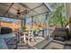 Inviting covered patio with dining table, chairs, ceiling fan, outdoor furniture, and a relaxing hot tub at 6925 W 27Th Ave, Wheat Ridge, CO 80033