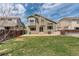 Backyard featuring a green lawn, patio, shed, and a fenced perimeter at 5368 Creek Way, Parker, CO 80134
