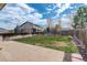Spacious backyard featuring a patio, well-maintained lawn, stone pathway, and secure wood fence, perfect for outdoor living at 5368 Creek Way, Parker, CO 80134