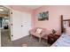 Pink bedroom showcasing a closet, chair and view through the window at 5368 Creek Way, Parker, CO 80134