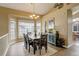 Elegant dining room with ample seating, a bay window, and stylish decor at 5368 Creek Way, Parker, CO 80134