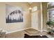 Welcoming foyer with hardwood floors, mountain-themed art, and ample natural light at 5368 Creek Way, Parker, CO 80134