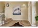 Spacious foyer with hardwood floors and artwork, creating a grand entrance at 5368 Creek Way, Parker, CO 80134