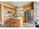 Modern kitchen featuring granite countertops, stainless steel appliances, and a center island at 5368 Creek Way, Parker, CO 80134