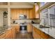 Well-equipped kitchen with granite countertops, stainless steel appliances, and ample cabinet space at 5368 Creek Way, Parker, CO 80134