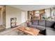 Open-concept living room leading to the kitchen with hardwood floors and neutral decor at 5368 Creek Way, Parker, CO 80134