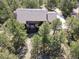 Aerial view of a home featuring a deck and lush surrounding greenery at 20380 Silver Horn Ln, Monument, CO 80132
