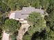 Aerial shot of a home with a long driveway surrounded by lush greenery at 20380 Silver Horn Ln, Monument, CO 80132