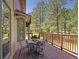 Outdoor deck providing serene wooded views, perfect for relaxation and al fresco dining at 20380 Silver Horn Ln, Monument, CO 80132