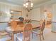 Charming dining room featuring striped walls and an open view to an adjacent eat-in kitchen at 20380 Silver Horn Ln, Monument, CO 80132