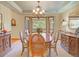 Elegant dining room with bay window, a chandelier, and classic furnishings at 20380 Silver Horn Ln, Monument, CO 80132