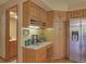 Inviting kitchen area featuring wood cabinetry, marble countertops, and stainless steel appliances at 20380 Silver Horn Ln, Monument, CO 80132