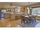 Open concept kitchen with stainless steel appliances, hardwood floors, and a breakfast bar at 20380 Silver Horn Ln, Monument, CO 80132