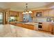 Spacious kitchen featuring stone countertops, stainless steel appliances, and hardwood floors at 20380 Silver Horn Ln, Monument, CO 80132