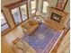 Open living room boasts a brick fireplace, plush seating, and seamless access to the outdoor deck at 20380 Silver Horn Ln, Monument, CO 80132