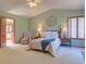 Comfortable bedroom features soft carpet, natural light and relaxing decor at 20380 Silver Horn Ln, Monument, CO 80132