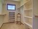Walk-in closet with built-in shelving and ample storage space at 20380 Silver Horn Ln, Monument, CO 80132