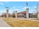 Attractive community center featuring a modern design, ample parking, and well-maintained landscaping, promoting community engagement at 9369 Longs Peak Dr, Henderson, CO 80640